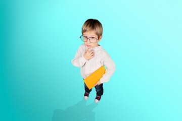 Cute smart child student posing