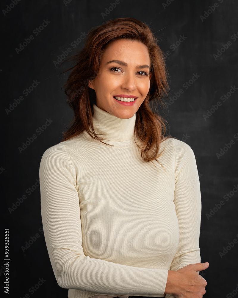 Wall mural studio portrait of mid aged woman cheerful smling against isolated background