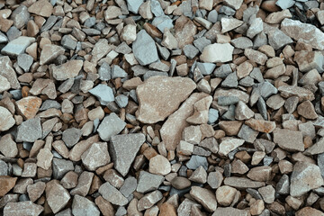 A close-up view of assorted gravel and crushed stones on a construction site, showcasing various...