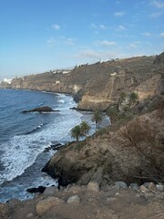 coast of the atlantic ocean with volcanic rocks and blu sky in Tenerife, Canary Islands, Spain