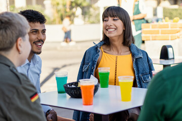 Vibrant sparkling drinks shared by diverse friends at urban cafe terrace