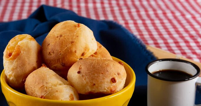 Minas Gerais cheese bread, hot, ina  wooden basket in clean brown background