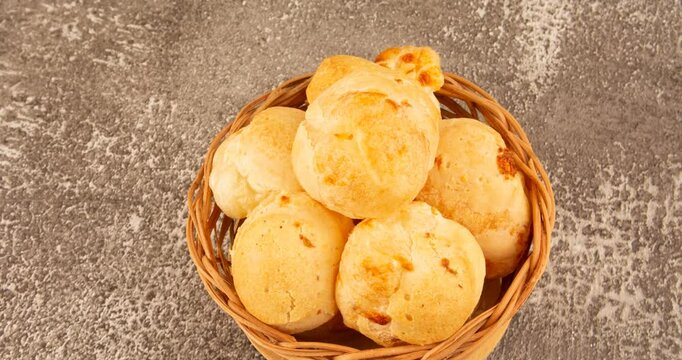 Minas Gerais cheese bread balls in a bowl and clean background front view
