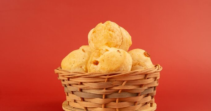 Minas Gerais cheese bread balls in a bowl and clean background front view
