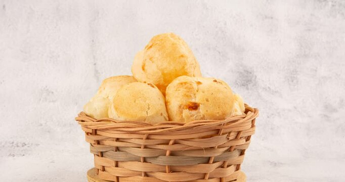Minas Gerais cheese bread balls in a bowl and clean background front view
