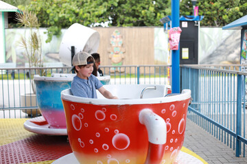 Little boy in a carnival eating candy and having fun fun spot in orlando 