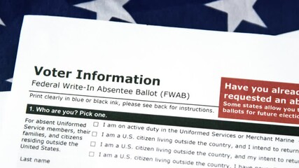 Absentee voter registration form 4k footage with the USA flag in the backdrop. American elections concept