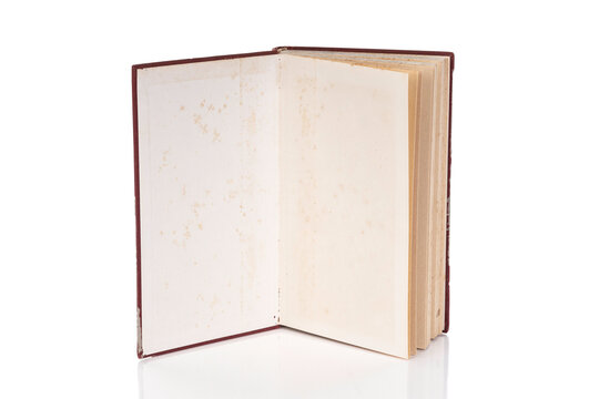 Open old book isolated on white background with clipping path.
