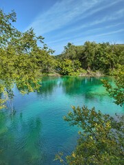 Crystal clear waters surrounded by lush greenery at Plitvice Lakes National Park, Croatia, a true natural wonder