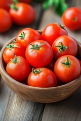 A bowl of fresh, ripe tomatoes sitting on wooden surface, showcasing the vivid colors and natural textures.
