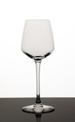 Close-up of wineglass on white background
