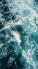 Fototapeta premium A close-up view of foamy waves on the ocean surface.