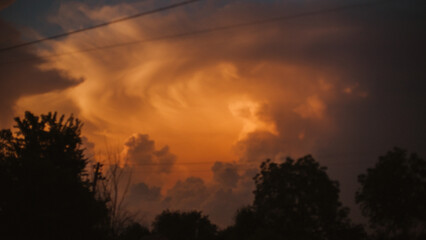 Beautiful sunset in clouds with trees