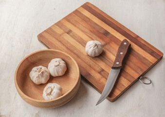 Garlic on a cutting board . Flat lay.