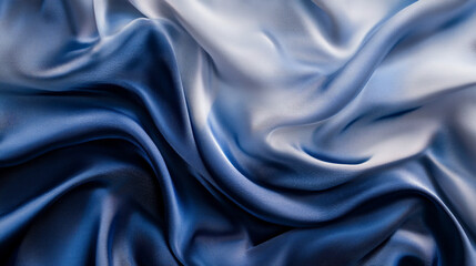 Obraz premium Abstract silk fabric in gradient tones of midnight blue and soft silver, with soft flowing waves creating an elegant, serene background.