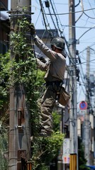 Technician climbing utility pole, repairing electrical wires, outdoor maintenance work, safety gear, occupational task, urban environment, sunny day, industrial concept