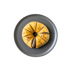 Close-up of a sliced sausage ring on a grey plate