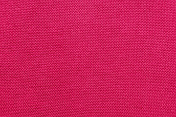 Knitted fabric fuchsia, dark pink, yarn. Creativity as a way to relax.