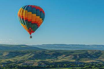 Obraz premium Colorful hot air balloons Floating high in the clear blue sky, the scenery is beautiful and bright.
