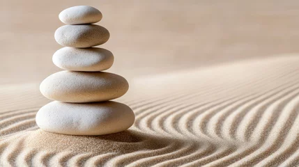 Selbstklebende Fototapeten A serene zen garden featuring stack of smooth stones on gently rippled sand, creating tranquil atmosphere that promotes relaxation and mindfulness © MarkFinal