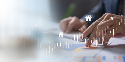 Analyzing Real Estate Market Trends concept. Business professional analyzing real estate data with...
