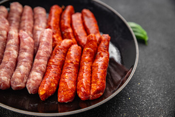 sausages meat raw beef, pork, chicken, lamb dish fresh delicious gourmet food background on the table rustic food top view copy space