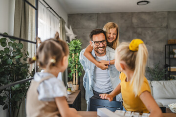 Happy family moment with single father give piggyback ride to daughter