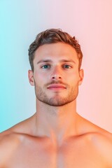 Obraz premium Portrait of a handsome man with healthy skin in colorful lighting