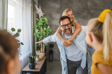 Happy family moment with single father give piggyback ride to daughter
