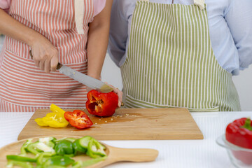 Part of woman slice vegetable in the kitchen