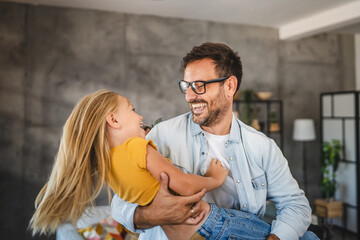 adult single father hold daughter and have fun with her