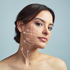 Portrait, woman and skincare with arrow for plastic surgery in studio, facial treatment and beauty filler of change. Girl, lines and procedure of face lift, medical transformation and gray background