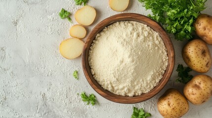 Fototapeta premium Potato flour on brown wooden bowl and some oats vegetable for food, gluten free copy space