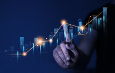 Businessman draw growing virtual hologram of statistics, graph and chart. Investment of growth on currency rate.Digital marketing concept.