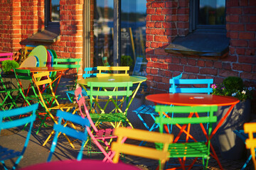 Colorful tables and chairs in an outdoor cafe or restaurant in Helsinki, Finland.