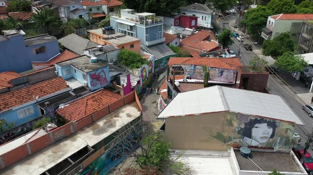 Drone shot of a vibrant neighborhood in Vila Madalena, Sao Paulo, highlighting colorful murals and urban art.