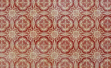 Azulejos, traditional Portuguese ceramic tiles on house wall, pattern background in red and beige