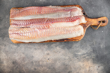 fillet raw white fish cod or halibut fresh meal food snack on the table copy space food background...