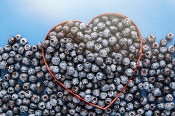 Blueberries Organic fresh blueberry, great bilberry on blue background 