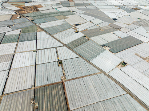 Aerial view of Masses of shimmering plastic greenhouses near El Ejido. Aerial view. Drone shot. Almer&iacute;a province, Andalusia, Spain.