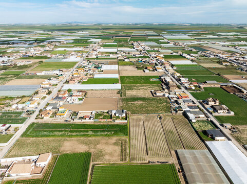 Aerial view of The semi rural district of La Algaida with its cultivated fields next to Sanl&uacute;car de Barrameda. Aerial view. Drone shot. C&aacute;diz province, Andalusia, Spain.