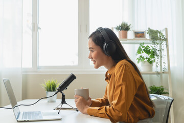 Close-up microphone on the table in podcasting record.