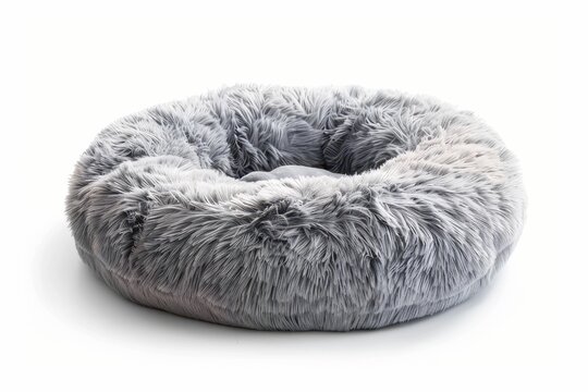 Soft round plush pet bed in grey on white background