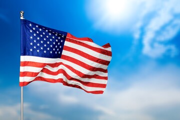 Fototapeta premium United State of America national flag in sky