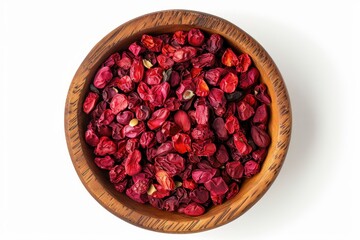 Top view of red barberries in wooden cup on white background