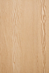 Fototapeta premium Close-up background of textured plywood sheets with an industrial raw finish emphasizing the wood grain.