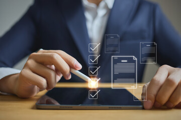 Business performance checklist and tracking, businessman using laptop and tablet Conduct...