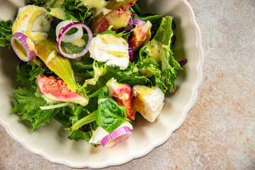 fig salad green lettuce, figs, soft cheese fresh meal food snack on the table copy space food background rustic top view keto or paleo diet vegetarian vegan food