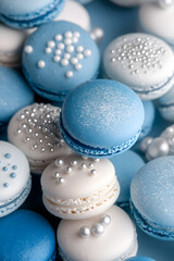 Obraz premium Assortment of macarons resembling a winter landscape, in shades of pastel blue and white with silver dust, on a soft gray canvas.
