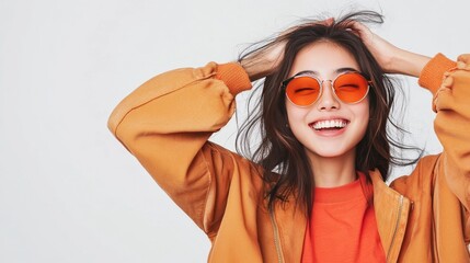 Positive Asian millennial in trendy jacket, isolated on white, smiling.